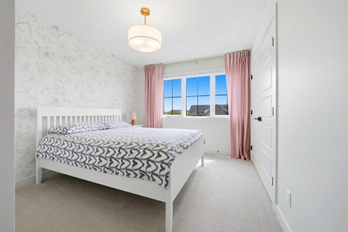 24 Monterra Landing, Cochrane Lake, AB - Indoor Photo Showing Bedroom