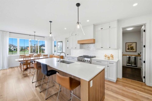 24 Monterra Landing, Cochrane Lake, AB - Indoor Photo Showing Kitchen With Upgraded Kitchen
