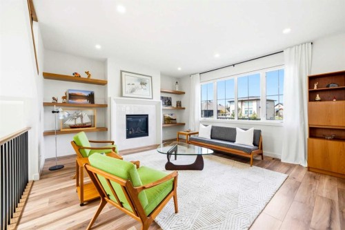 24 Monterra Landing, Cochrane Lake, AB - Indoor Photo Showing Living Room With Fireplace
