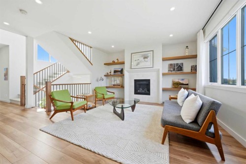 24 Monterra Landing, Cochrane Lake, AB - Indoor With Fireplace