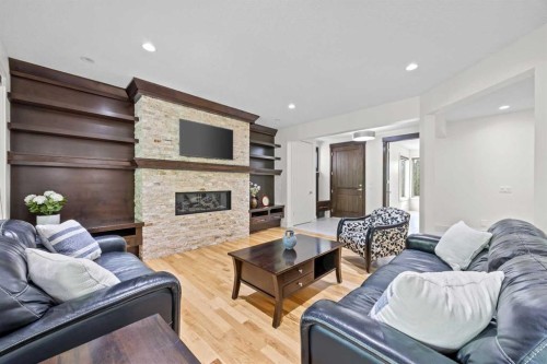 89 Evergreen Mount Sw, Calgary, AB - Indoor Photo Showing Living Room With Fireplace