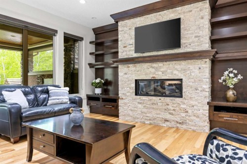 89 Evergreen Mount Sw, Calgary, AB - Indoor Photo Showing Living Room With Fireplace