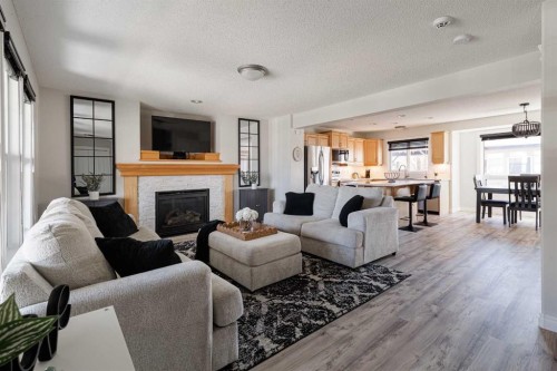 724 Prestwick Circle Se, Calgary, AB - Indoor Photo Showing Living Room With Fireplace