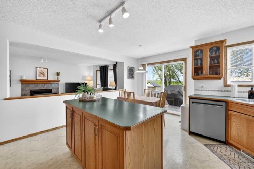 112 Hidden Ranch Crescent Nw, Calgary, AB - Indoor Photo Showing Other Room With Fireplace