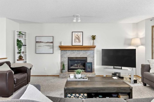 112 Hidden Ranch Crescent Nw, Calgary, AB - Indoor Photo Showing Living Room With Fireplace