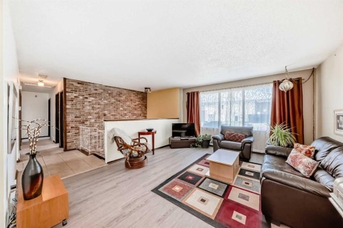 5539 Dalhart Road Nw, Calgary, AB - Indoor Photo Showing Living Room With Fireplace
