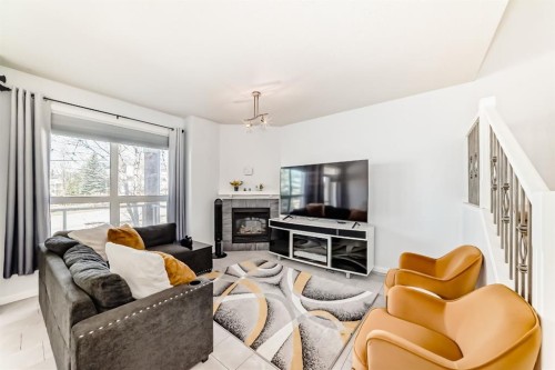 124 Royal Manor Nw, Calgary, AB - Indoor Photo Showing Living Room With Fireplace