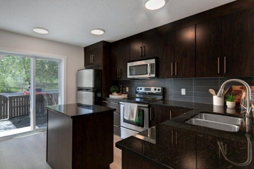 95 Aspen Hills Drive Sw, Calgary, AB - Indoor Photo Showing Kitchen With Stainless Steel Kitchen With Double Sink