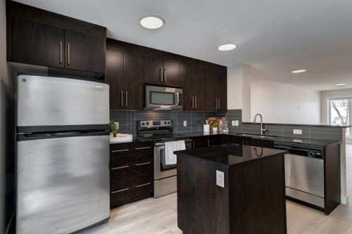 95 Aspen Hills Drive Sw, Calgary, AB - Indoor Photo Showing Kitchen With Stainless Steel Kitchen With Upgraded Kitchen