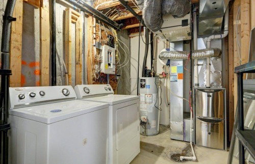 95 Aspen Hills Drive Sw, Calgary, AB - Indoor Photo Showing Laundry Room