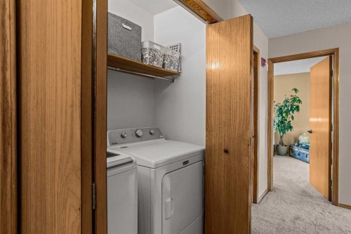 12-9 Blackrock Crescent West, Canmore, AB - Indoor Photo Showing Laundry Room