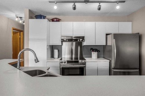 12-9 Blackrock Crescent West, Canmore, AB - Indoor Photo Showing Kitchen With Double Sink With Upgraded Kitchen