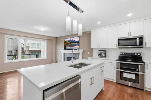 78 Everglen Way Sw, Calgary, AB - Indoor Photo Showing Kitchen With Double Sink With Upgraded Kitchen