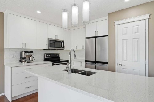78 Everglen Way Sw, Calgary, AB - Indoor Photo Showing Kitchen With Double Sink With Upgraded Kitchen