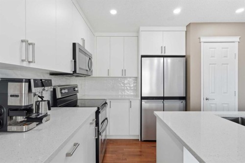 78 Everglen Way Sw, Calgary, AB - Indoor Photo Showing Kitchen With Double Sink With Upgraded Kitchen