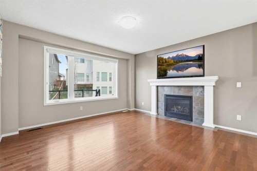 78 Everglen Way Sw, Calgary, AB - Indoor Photo Showing Living Room With Fireplace