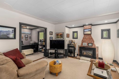 3035 4 Street Sw, Calgary, AB - Indoor Photo Showing Living Room With Fireplace