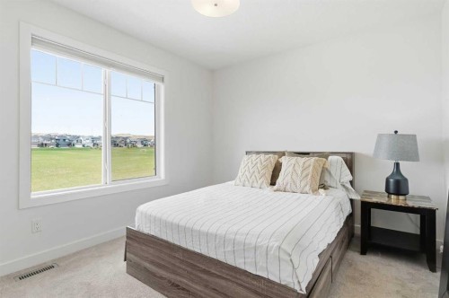 328 Bayview Street Sw, Airdrie, AB - Indoor Photo Showing Bedroom