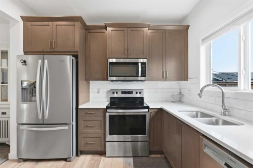 328 Bayview Street Sw, Airdrie, AB - Indoor Photo Showing Kitchen With Stainless Steel Kitchen With Double Sink