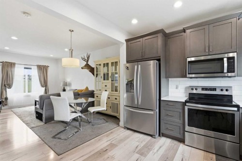 328 Bayview Street Sw, Airdrie, AB - Indoor Photo Showing Kitchen With Stainless Steel Kitchen