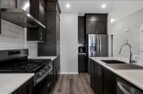 101-Dawson Drive, Chestermere, AB - Indoor Photo Showing Kitchen With Upgraded Kitchen