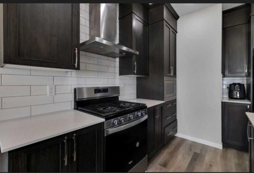 101-Dawson Drive, Chestermere, AB - Indoor Photo Showing Kitchen