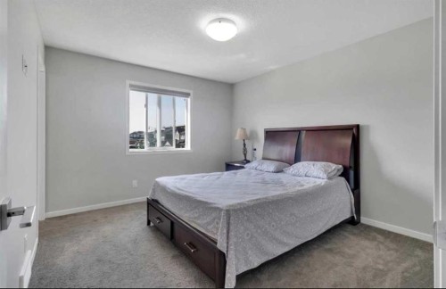 101-Dawson Drive, Chestermere, AB - Indoor Photo Showing Bedroom