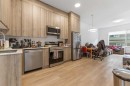 211-101 Panatella Square Nw, Calgary, AB  - Indoor Photo Showing Kitchen With Double Sink 