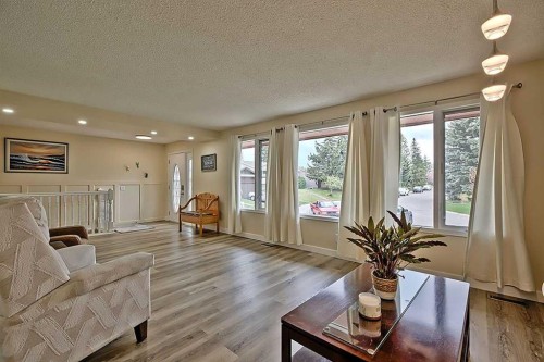 48 Deermont Way Se, Calgary, AB - Indoor Photo Showing Living Room