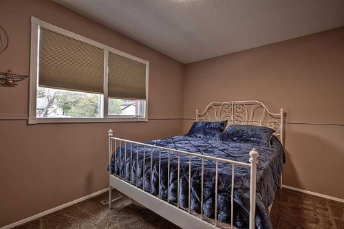 48 Deermont Way Se, Calgary, AB - Indoor Photo Showing Bedroom