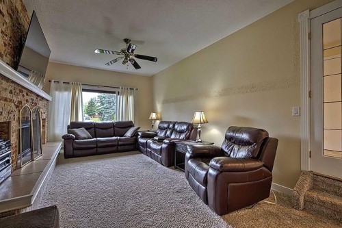 48 Deermont Way Se, Calgary, AB - Indoor Photo Showing Living Room With Fireplace
