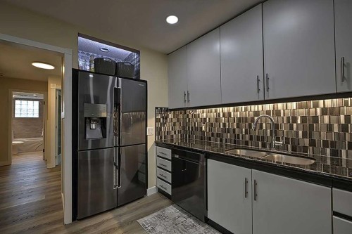 48 Deermont Way Se, Calgary, AB - Indoor Photo Showing Kitchen With Double Sink