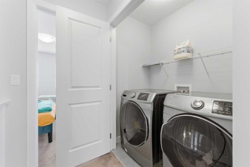 151 Evanscrest Park Nw, Calgary, AB - Indoor Photo Showing Laundry Room