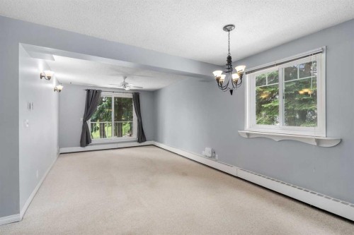 202C-5601 Dalton Drive Nw, Calgary, AB - Indoor Photo Showing Other Room