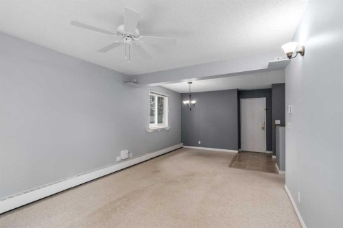 202C-5601 Dalton Drive Nw, Calgary, AB - Indoor Photo Showing Other Room