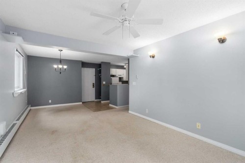 202C-5601 Dalton Drive Nw, Calgary, AB - Indoor Photo Showing Other Room