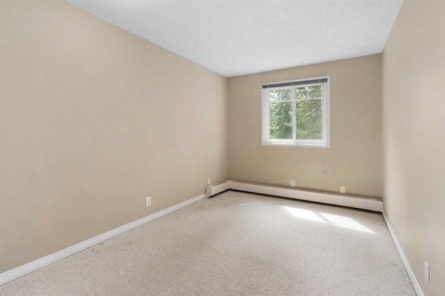 202C-5601 Dalton Drive Nw, Calgary, AB - Indoor Photo Showing Other Room