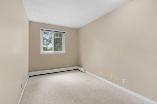 202C-5601 Dalton Drive Nw, Calgary, AB - Indoor Photo Showing Other Room