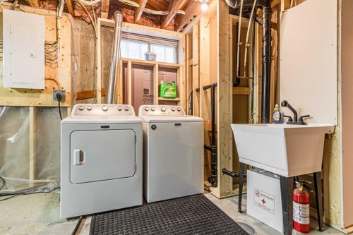 111 Lynnview Way Se, Calgary, AB - Indoor Photo Showing Laundry Room