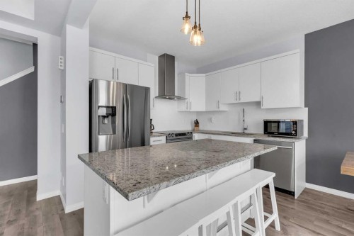 304 Windrow Crescent Sw, Airdrie, AB - Indoor Photo Showing Kitchen With Stainless Steel Kitchen With Upgraded Kitchen