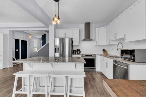 304 Windrow Crescent Sw, Airdrie, AB - Indoor Photo Showing Kitchen With Stainless Steel Kitchen With Double Sink With Upgraded Kitchen