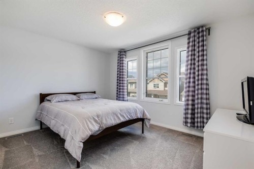 304 Windrow Crescent Sw, Airdrie, AB - Indoor Photo Showing Bedroom