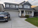 704 Stonehaven Drive, Carstairs, AB  - Outdoor With Deck Patio Veranda With Facade 