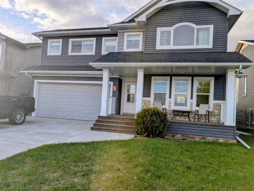 704 Stonehaven Drive, Carstairs, AB - Outdoor With Deck Patio Veranda With Facade