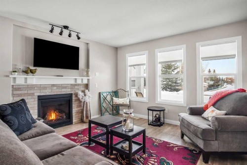 704 Stonehaven Drive, Carstairs, AB - Indoor Photo Showing Living Room With Fireplace