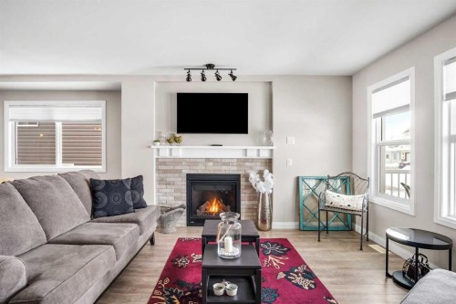 704 Stonehaven Drive, Carstairs, AB - Indoor Photo Showing Living Room With Fireplace