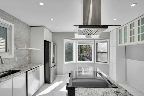 127 Woodstock Road Sw, Calgary, AB - Indoor Photo Showing Kitchen With Upgraded Kitchen
