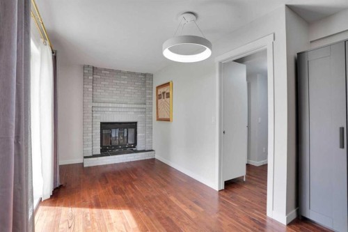 127 Woodstock Road Sw, Calgary, AB - Indoor With Fireplace