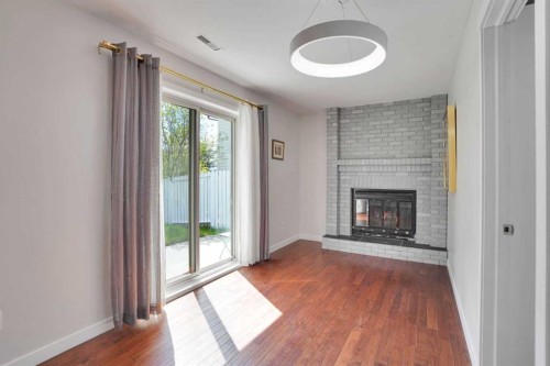 127 Woodstock Road Sw, Calgary, AB - Indoor With Fireplace