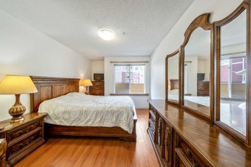 2132-700 Willowbrook Road Nw, Airdrie, AB - Indoor Photo Showing Bedroom